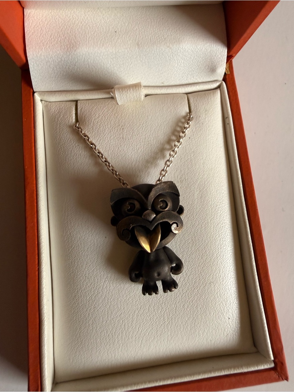 Black Tiki Pendant Necklace with Gold Accent